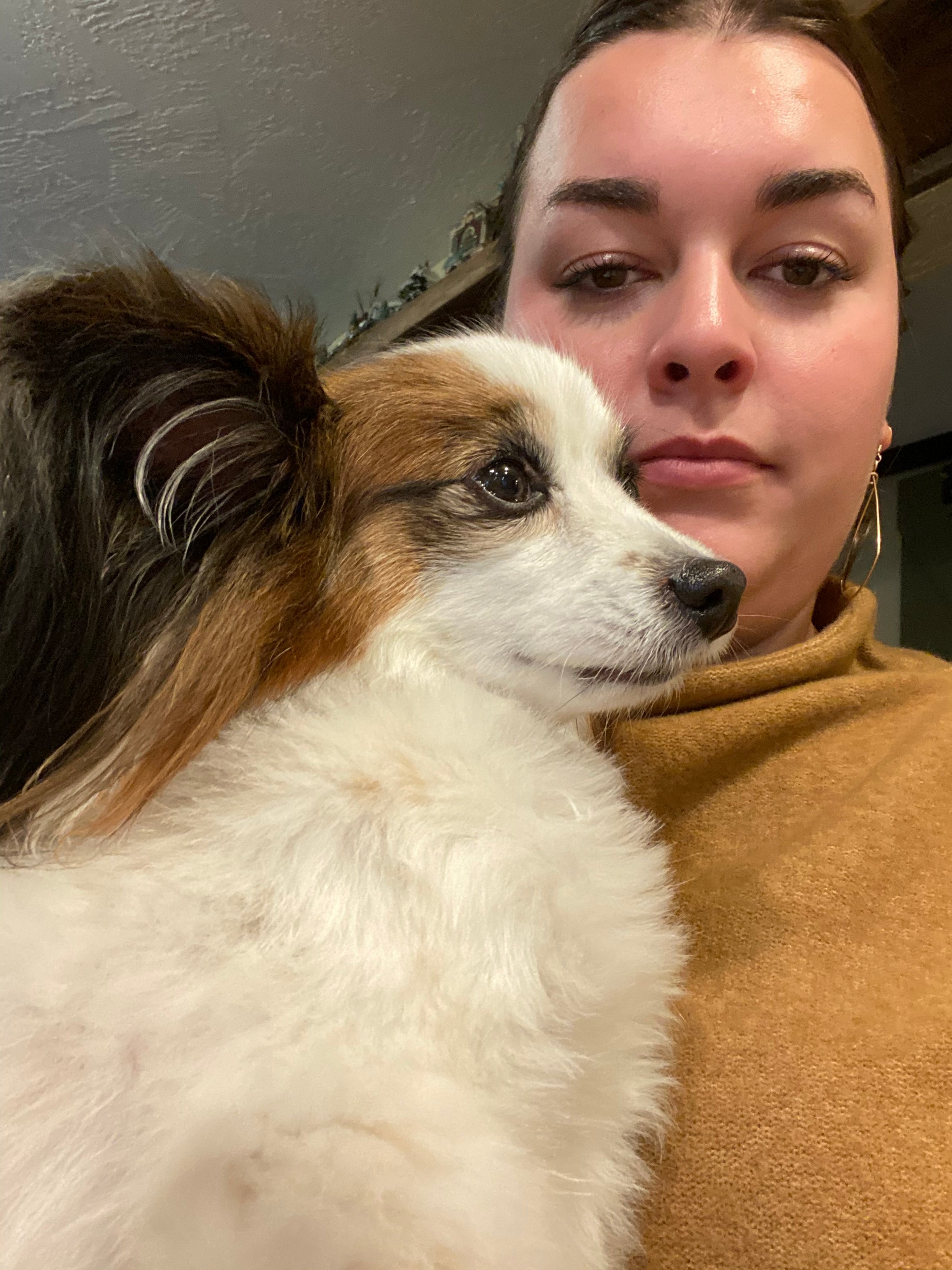 Person with a dog on a neutral background